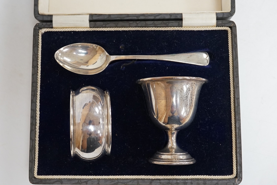 Three assorted silver christening sets including spoon, fork and napkin ring by William Hutton & Sons, London, 1896, one other set with steel knife, two cased sets of silver coffee spoons and a cased set of six Japanese